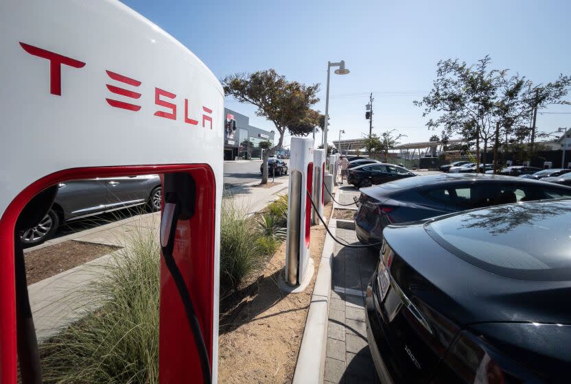 SANTA MONICA, CA - AUGUST 20: Paul Scott, co-founder of Plug in America, an electric car advocacy group, was instrumental in getting a Tesla charging station built at Santa Monica Boulevard between 14th and 15th Streets. There are 26 superchargers with another 36 opening soon on an adjacent lot. Photographed on Saturday, Aug. 20, 2022 in Santa Monica, CA. (Myung J. Chun / Los Angeles Times)