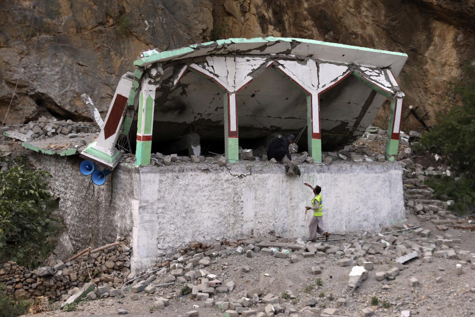 Security personnel inspect the site of suicide bomber attack inside a roadside mosque in the Khyber district in Khyber Pakhtunkhwa province, of Pakistan, Tuesday, July 25, 2023. A suicide bomber blew himself up inside a roadside mosque when a police officer tried to arrest him after a chase in northwestern Pakistan near the Afghan border on Tuesday, killing the officer, police said. (AP Photo/Muhammad Sajjad)