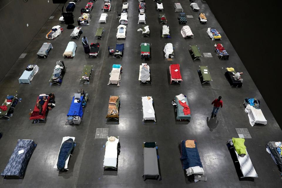 Beds fill a homeless shelter inside the San Diego Convention Center on Aug. 1, 2020. 
 California launched a new database on April 7, 2021, that collects information on the homeless, including their race and ethnicity, gender, and age and which services they sought and received.