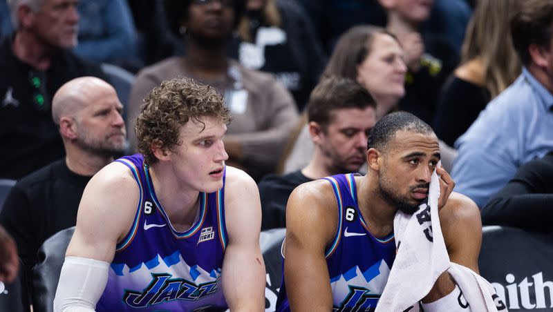 Utah Jazz forward Lauri Markkanen (23) and Utah Jazz guard Talen Horton-Tucker (0) react after losing an NBA game against the Phoenix Suns at Vivint Arena in Salt Lake City on March 27, 2023.