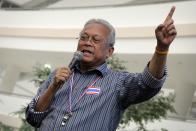 Thai anti-government protest leader Suthep Thaugsuban gestures as he addresses his supporters in Bangkok December 3, 2013. Thaugsuban said on Tuesday he will continue the fight to oust Prime Minister Yingluck Shinawatra, despite a government decision earlier not to confront protesters. REUTERS/Stringer (THAILAND - Tags: CIVIL UNREST POLITICS)