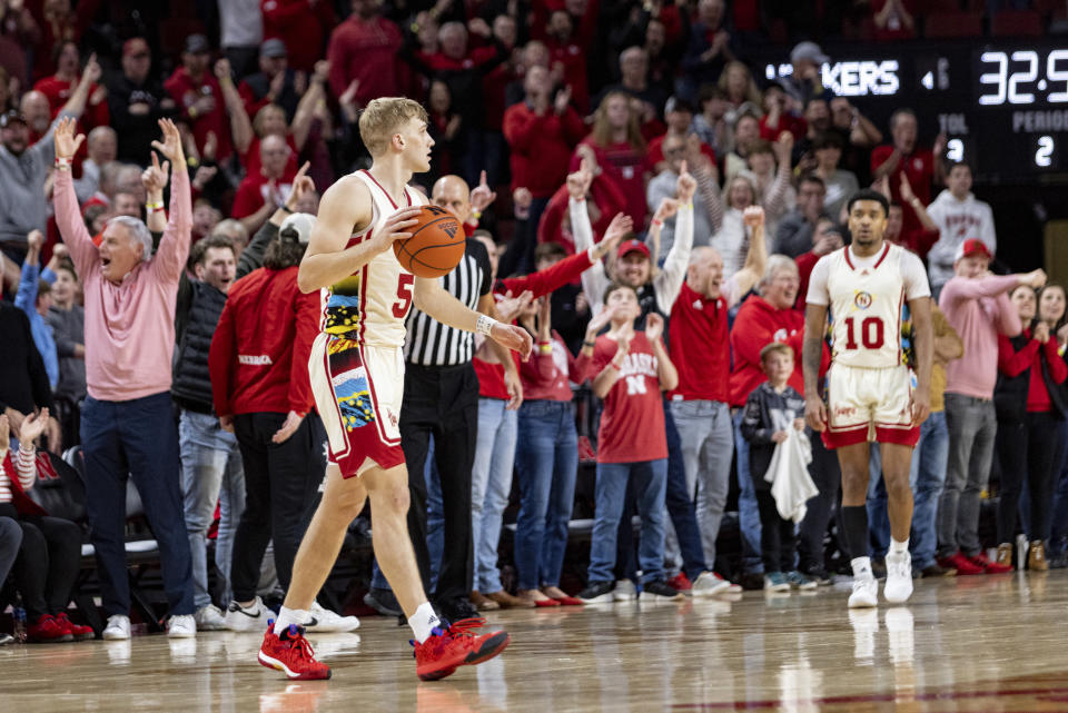 Nebraska's Sam Griesel (5) dribbles out the final seconds in overtime against Wisconsin during an NCAA college basketball game Saturday, Feb. 11, 2023, in Lincoln, Neb. (AP Photo/John Peterson)