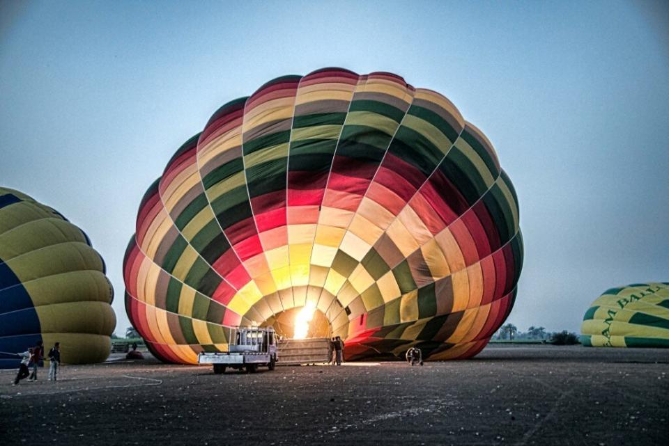 In this image made available by Christopher Michel, the launch site near Luxor in Egypt, shortly prior to a hot air balloon explosion which killed at least 18 tourists including a number of tourists Tuesday Feb. 26, 2013. Witnesses described hearing a loud explosion before seeing plumes of smoke as the balloon caught fire and plunged into a sugar cane field west of Luxor, which is 320 miles (510km) south of the capital Cairo. The casualties are believed to include British and French tourists, as well as other nationalities, a security official in the country said. (AP Photo/Christopher Michel)