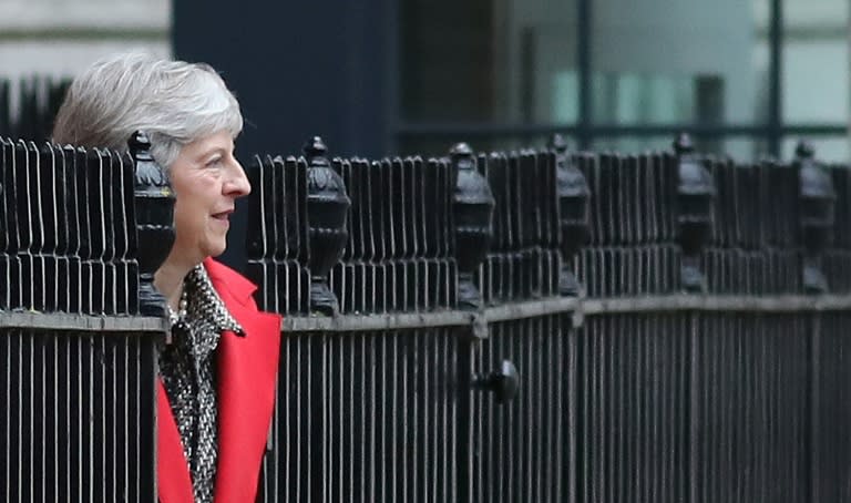 May says she is determined to stay on as prime minister and deliver Brexit