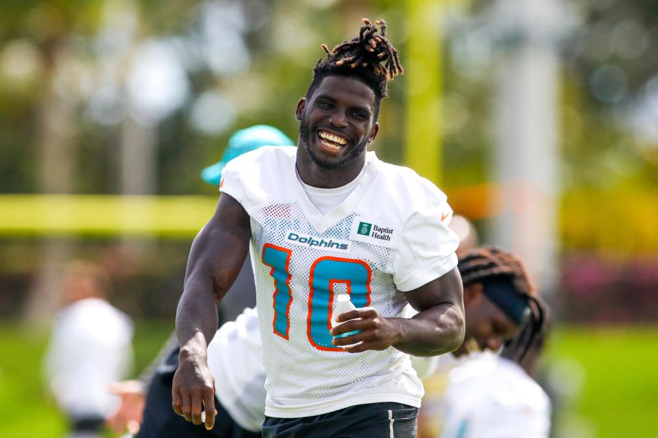 Jun 2, 2022; Miami Gardens, Florida, USA; Miami Dolphins wide receiver Tyreek Hill (10) reacts from the field during minicamp at Baptist Health Training Complex. Mandatory Credit: Sam Navarro-USA TODAY Sports