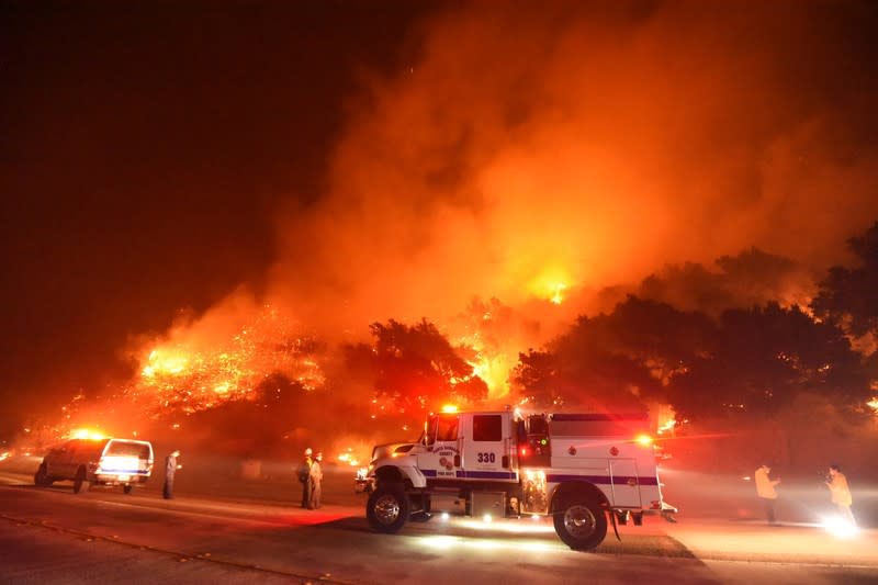 Firefighters battle flames off Highway 154 north of Santa Barbara, California