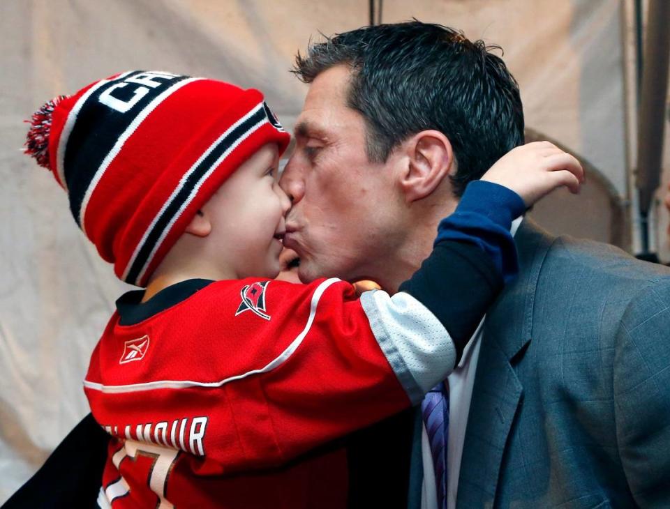 A 2016 photo shows Rod Brind’Amour, right, getting a kiss from his son Brooks Brind’Amour during a red carpet reception held before an NHL game played between the Carolina Hurricanes and the Pittsburgh Penguins at the PNC Arena in Raleigh, N.C. on 2016.