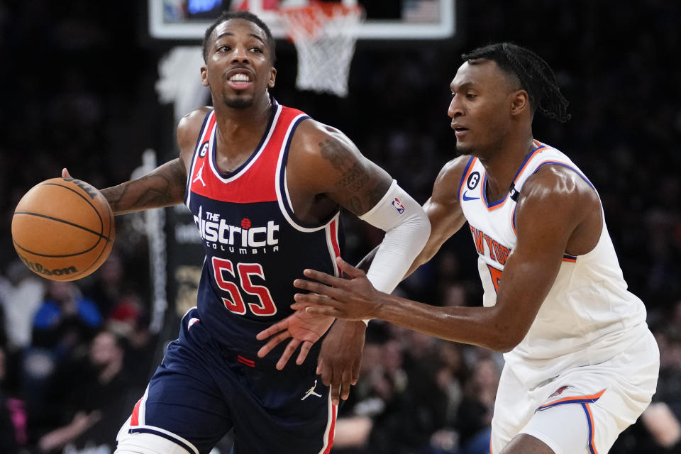 New York Knicks' Immanuel Quickley, right, defends Washington Wizards' Delon Wright (55) during the second half of an NBA basketball game Sunday, April 2, 2023, in New York. The Knicks won 118-109. (AP Photo/Frank Franklin II)
