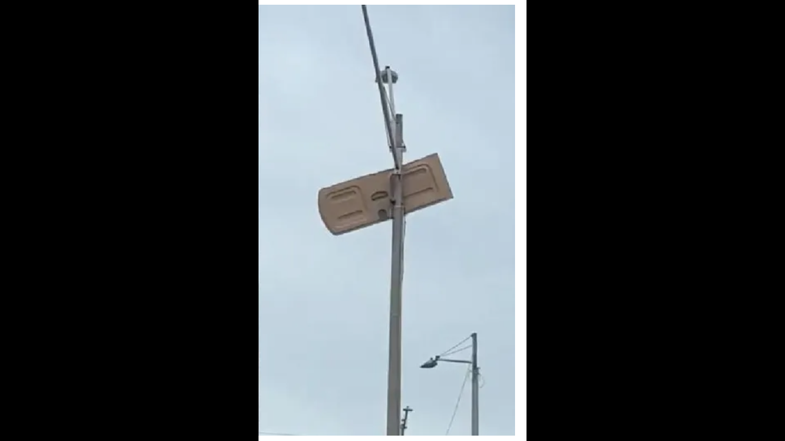 After a tornado hit the area early Oct. 12 in Dunedin Florida, a local man took a picture of portable toilet door stuck on a light pole outside a McDonald’s/COURTESY BRAD NAPOLI