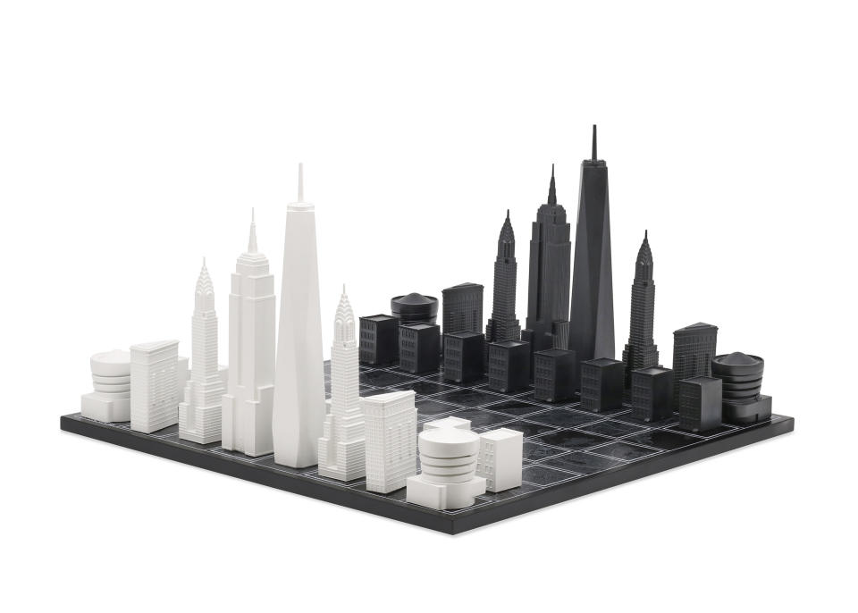 This image provided by Skyline Chess shows a chess set with pieces as iconic skyline buildings. Splurge on Skyline Chess' sets of iconic cities, including London, Tokyo, New York and Los Angeles, in stainless steel, acrylic or bronze. New York, for instance, with One World Trade Tower and the Empire State building as king and queen, might face off against Chicago, with the Willis Tower and the John Hancock Centre as the royal couple. (Skyline Chess via AP)