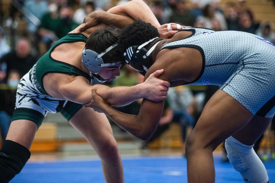 Minisink Valley's PJ Duke, left, wrestles Monroe-Woodbury's Jordan Brown in the 138-pound weight class during the Section 9 Division 1 wrestling championships at Monroe-Woodbury High School in Central Valley on Saturday, February 12, 2022.