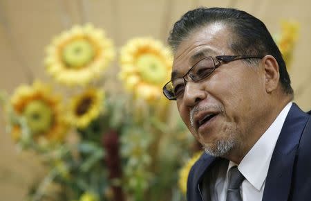Japanese discount store operator Don Quijote Holdings CEO Takao Yasuda speaks during an interview with Reuters at the company's headquarters in Tokyo in this September 30, 2014 file photo. REUTERS/Toru Hanai/Files