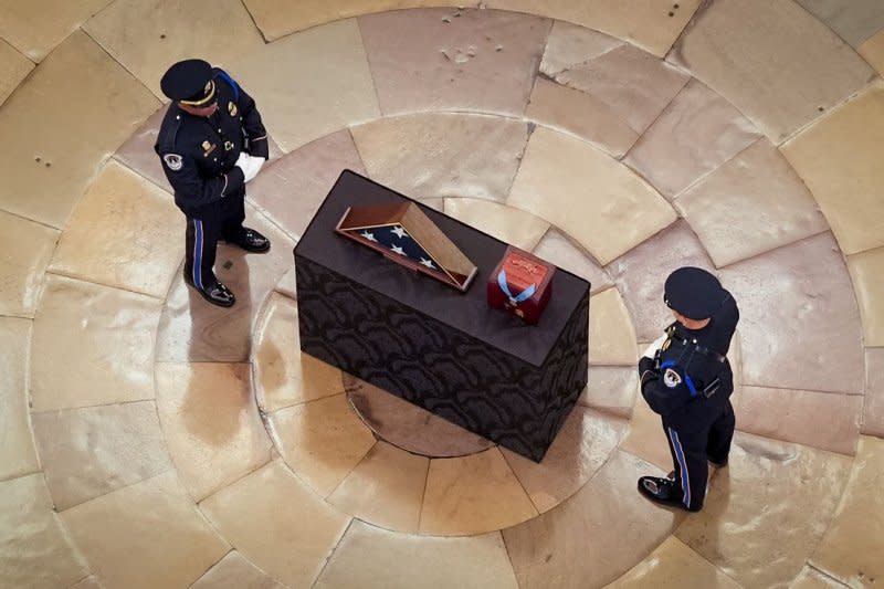 An honor guard stands at an urn containing the cremated remains of retired Army Col. Ralph Puckett Jr. during his congressional tribute in the rotunda of the U.S. Capitol in Washington, D.C., on Monday, Pool Photo by Kevin Dietsch/UPI