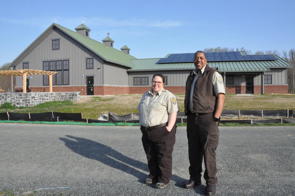 Kate Toniolo, project Leader of the Coastal Delaware National Wildlife Refuge Complex, and Oscar Reed, manager of Bombay Hook National Wildlife Refuge, stand outside the new Bombay Hook visitors center which is still under construction east of Smyrna April 5, 2023.