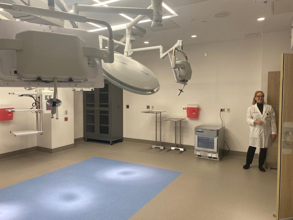 Jean Goodman, chair of the department of obstetrics, gynecology and women's health, on Tuesday shows off an operating room in the new University of Missouri Children's Hospital.