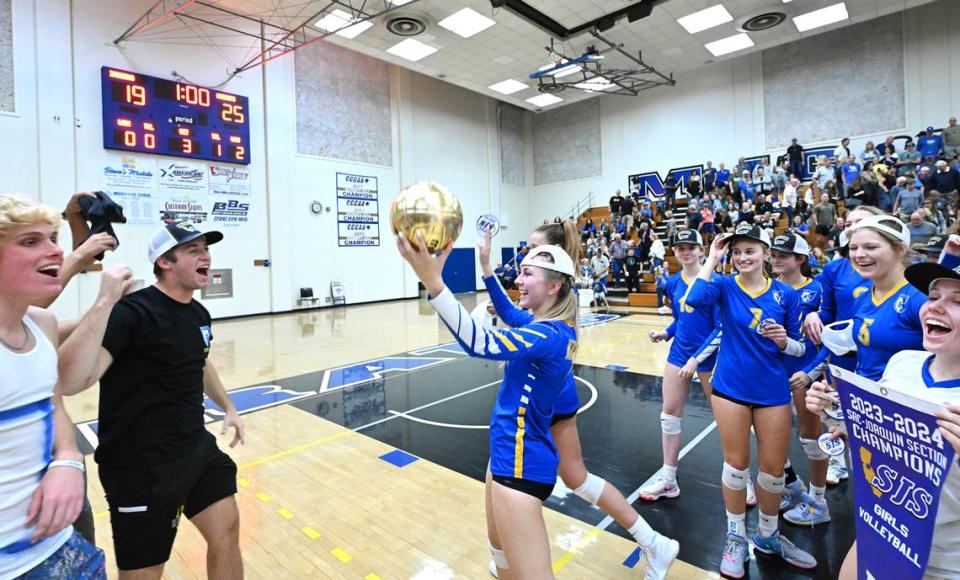 Leah Van Wyngarden, middle, and her Ripon Christian teammates celebrate their 3-0 victory over Ripon for the Sac-Joaquin Section Division IV championship at Modesto Junior College in Modesto, Calif., Saturday, Nov. 4, 2023.