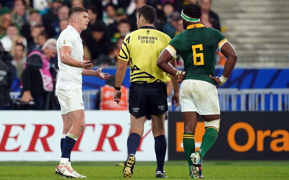 Owen Farrell (left) protests to referee Ben O'Keefe