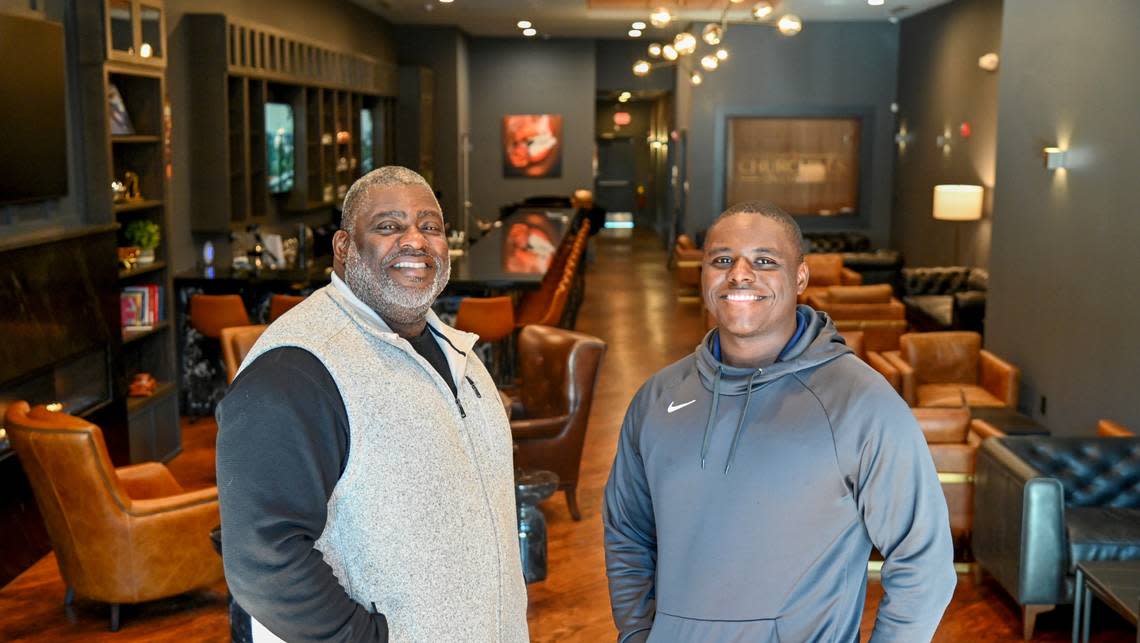 Bruce Riggins, left, owner of Churchills on Cherry, and his son Nicholas Riggins, who has a minority stake in the business.