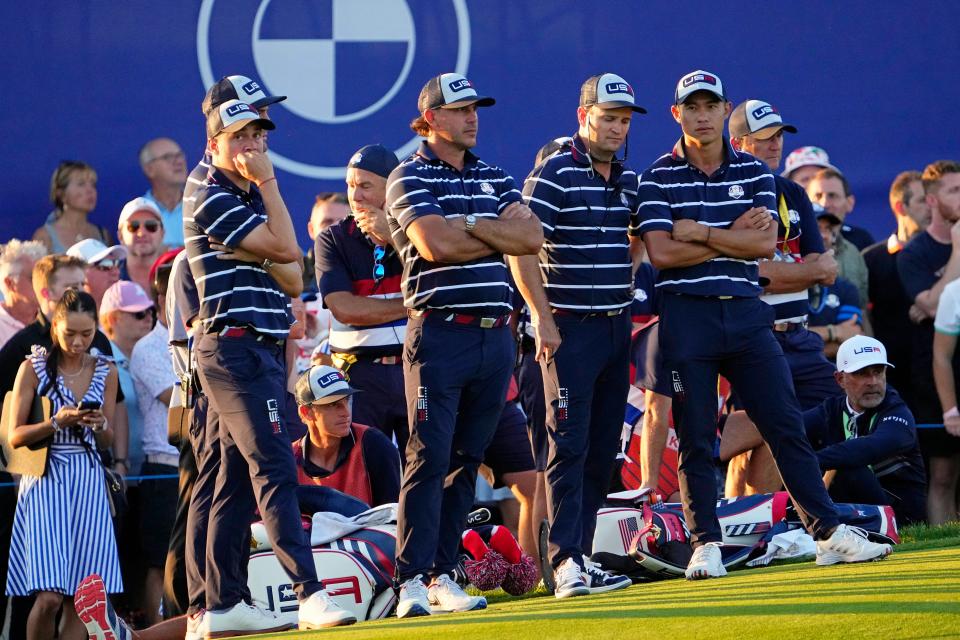 Team USA waits for the final pairing on the 18th hole during Day 1 four-ball play at the 44th Ryder Cup at Marco Simone Golf and Country Club in Rome.