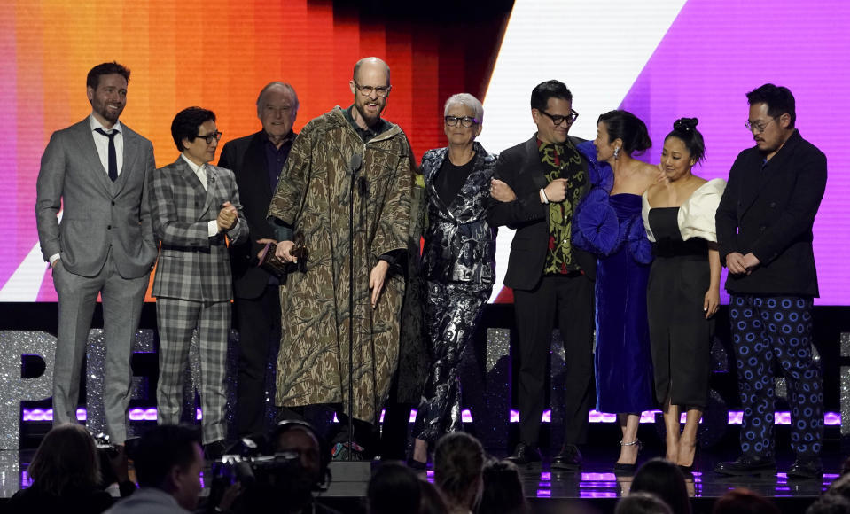 Paul Rogers, from left, Ke Huy Quan, Tim Headington, Daniel Scheinert, Jamie Lee Curtis, Jonathan Wang, Michelle Yeoh, Stephanie Hsu, and Daniel Kwan accept the best feature award for "Everything Everywhere All at Once" at the Film Independent Spirit Awards on Saturday, March 4, 2023, in Santa Monica, Calif. (AP Photo/Chris Pizzello)