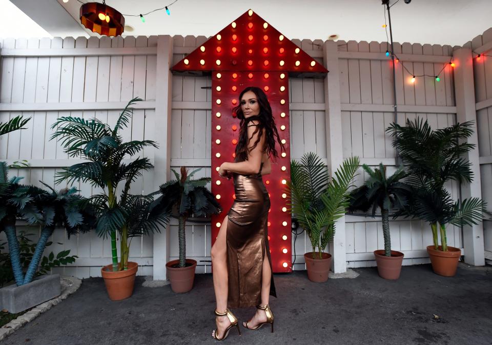 Singer-songwriter Kylie Morgan stands outside The Dive Motel last month in Nashville.