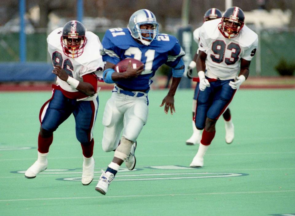 Middle Tennessee State running back Joe Campbell (21) moves away from a couple of Jackson State defenders during the Blue Raiders 28-7 victory in the first round of the NCAA Division I-AA playoffs at home in Murfreesboro Nov. 24, 1990.