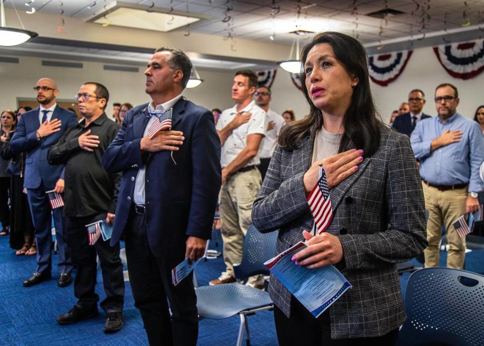 A group of 60 South Florida residents, including Angelica Fuentes of Honduras, take the Oath of Allegiance as new U.S. Citizens during a citizenship ceremony recognizing the Military Appreciation Month at the USCIS Hialeah Field Office, on Wednesday, May 3, 2023.