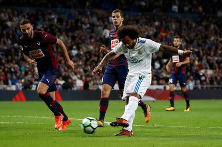 Soccer Football - La Liga Santander - Real Madrid vs SD Eibar - Santiago Bernabeu Stadium, Madrid, Spain - October 22, 2017 Real Madrid’s Marcelo scores their third goal REUTERS/Juan Medina