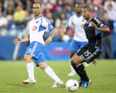 MONTREAL, CANADA - AUGUST 18: Marco Di Vaio #9 of the Montreal Impact passes the ball in front of Justin Morrow #15 of the San Jose Earthquakes during the match at the Saputo Stadium on August 18, 2012 in Montreal, Quebec, Canada. The Impact defeated the Earthquakes 3-1. (Photo by Richard Wolowicz/Getty Images)