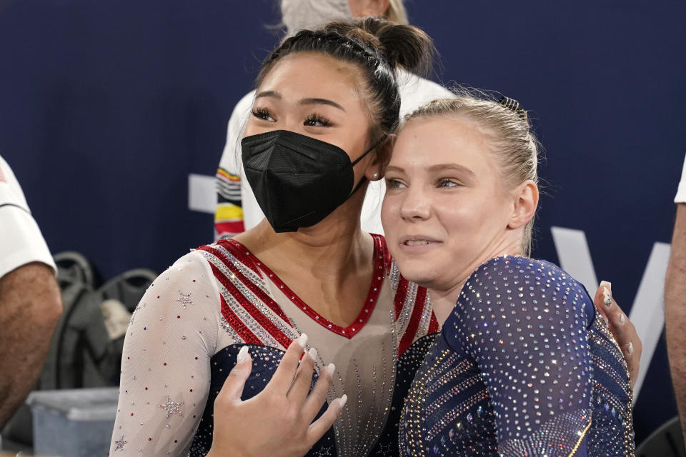 Gold medallist Sunisa Lee of the Unites States celebrates with teammate Jade Carey at the end of the artistic gymnastics women's all-around at the 2020 Summer Olympics, Thursday, July 29, 2021, in Tokyo. (AP Photo/Gregory Bull)