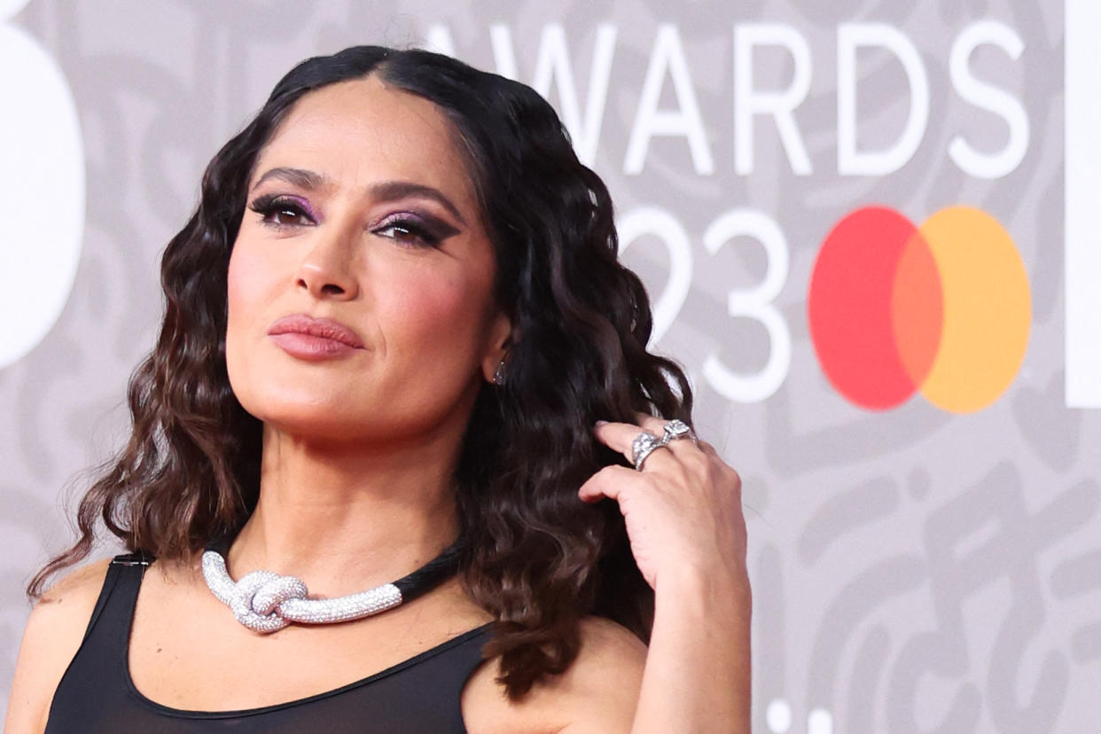 Mexican actress Salma Hayek poses on the red carpet upon arrival for the BRIT Awards 2023 in London on February 11, 2023. - RESTRICTED TO EDITORIAL USE  NO POSTERS  NO MERCHANDISE NO USE IN PUBLICATIONS DEVOTED TO ARTISTS (Photo by ISABEL INFANTES / AFP) / RESTRICTED TO EDITORIAL USE  NO POSTERS  NO MERCHANDISE NO USE IN PUBLICATIONS DEVOTED TO ARTISTS (Photo by ISABEL INFANTES/AFP via Getty Images)