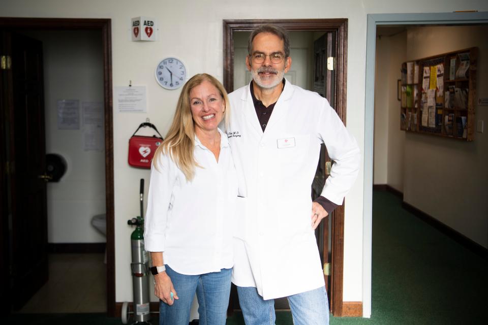 Head of nursing Kate Hull  and physician Jean-Francois Reat pose for a photo at the Free Medical Clinic of Oak Ridge, Wednesday, Nov. 23, 2022.
