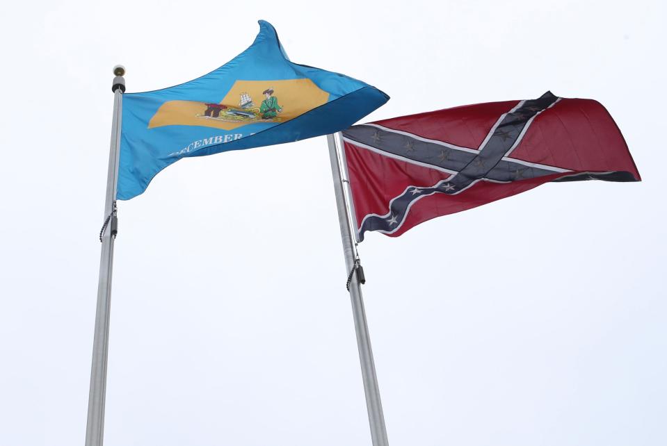 A Confederate flag flies alongside a Delaware state flag at the monument to Delawareans who supported the Confederacy at the Marvel Museum in Georgetown.