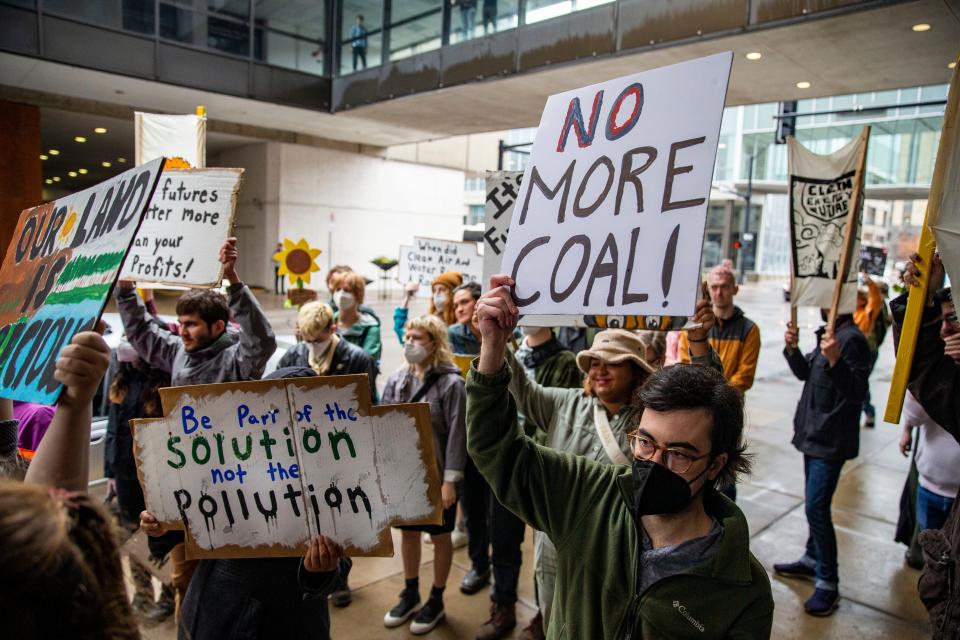 Climate activists, Indigenous leaders, and community members march to the downtown offices of MidAmerican Energy to demand an end to coal fired power plants in Iowa, Friday, April 22, 2022.