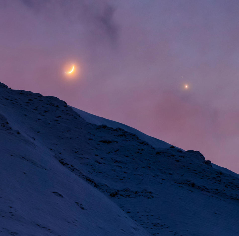 A photographer captures a triple conjunction of the moon, Jupiter and Saturn from the Alborz Mountains in Iran, after sunset on December 17, 2020, ahead of the great conjunction. / Credit: Alireza Vafa / NASA Astronomy Picture of the Day