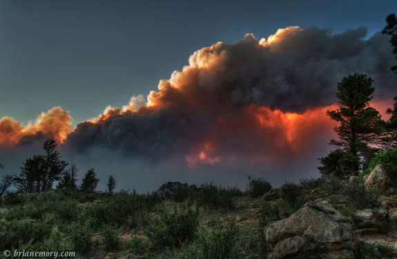 "There's quite a fire burning west of Fort Collins, Colorado. It created some pretty spectacular views as the setting sun shone through the clouds and smoke," Brian Emory who took this shot of the High Park Fire on June 10, 2012, wrote on 