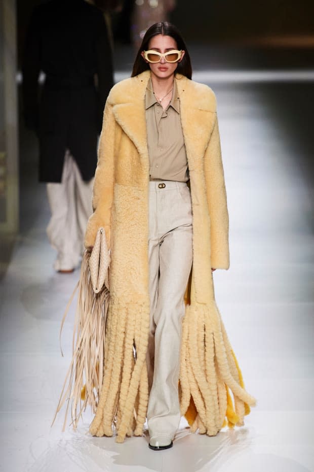 <p><strong>Bottega Veneta:</strong> "Daniel Lee delivered a knockout collection of ready-to-wear and accessories. As soon as this look came down the runway, we knew the 'it' items for fall were going to be the fringe coat and pouch."</p>