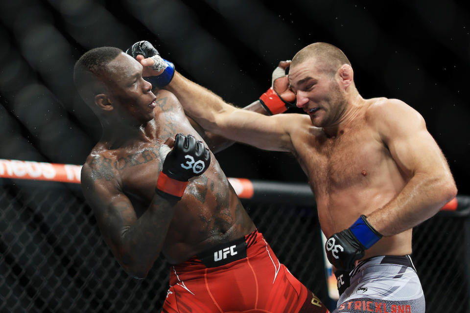 SYDNEY, AUSTRALIA – SEPTEMBER 10: Sean Strickland of United States trades punches with Israel Adesanya of <a class="link " href="https://sports.yahoo.com/soccer/teams/nigeria-women/" data-i13n="sec:content-canvas;subsec:anchor_text;elm:context_link" data-ylk="slk:Nigeria;sec:content-canvas;subsec:anchor_text;elm:context_link;itc:0">Nigeria</a> (L), during the UFC 293 event at Qudos Bank Arena on September 10, 2023 in Sydney, Australia. (Photo by Mark Evans/Getty Images)
