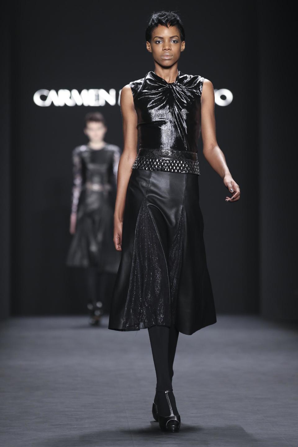 The Carmen Marc Valvo Fall 2014 collection is modeled during Fashion Week, Friday, Feb. 7, 2014, in New York. (AP Photo/John Minchillo)