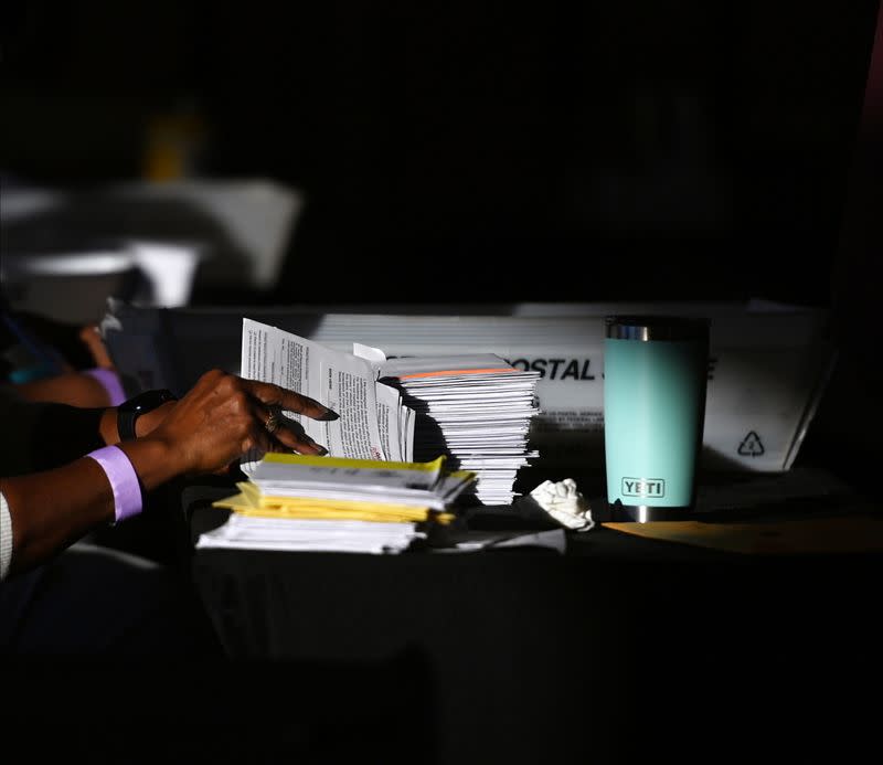 FILE PHOTO: Employees of the Fulton County Board of Registration and Elections process ballots in Atlanta