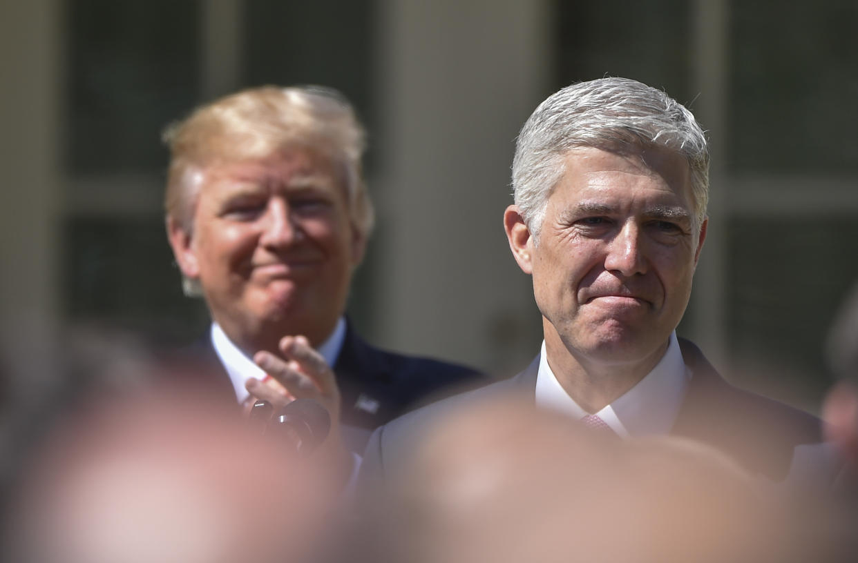 The Koch network spent millions supporting the nomination of Neil Gorsuch (right), seen here with President Donald Trump following Gorsuch's swearing-in ceremony on April 10. (Photo: The Washington Post via Getty Images)