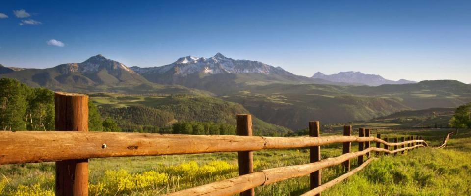 A ranch fence overlooking Mount Wilson, Colorado