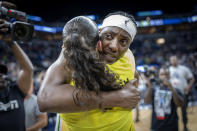 Minnesota Lynx center Sylvia Fowler, rear, hugs Seattle Storm guard Sue Bird (10) after a WNBA basketball game Friday, Aug. 12, 2022, in Minneapolis. (Elizabeth Flores/Star Tribune via AP)