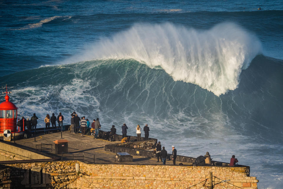 NAZARE, PORTUGAL - 2020/10/29: People watch the first big swell of the winter season at Praia do Norte. (Photo by Henrique Casinhas/SOPA Images/LightRocket via Getty Images)
