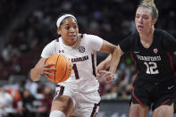 South Carolina guard Zia Cooke (1) dribbles the ball as Stanford guard Lexie Hull (12) defends during the first half of an NCAA college basketball game Tuesday, Dec. 21, 2021, in Columbia, S.C. (AP Photo/Sean Rayford)