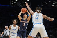 Virginia's Kihei Clark (0) shoots against North Carolina's Armando Bacot (5) in the first half of an NCAA college basketball game during quarterfinals of the Atlantic Coast Conference men's tournament, Thursday, March 10, 2022, in New York. (AP Photo/John Minchillo)