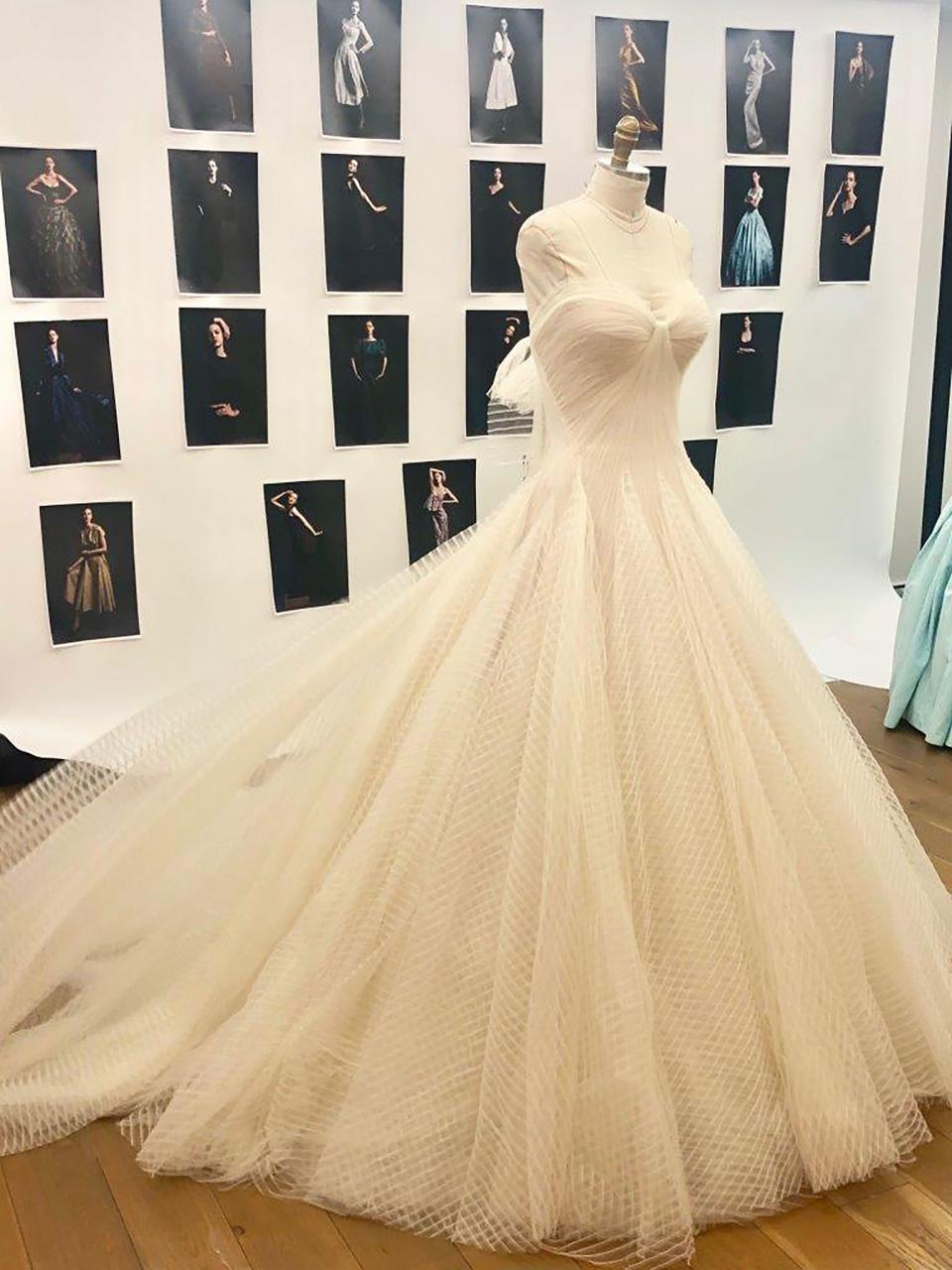 The bride wore a custom Zac Posen wedding dress featuring a strapless sweetheart neckline and multiple layers of striped tulle.