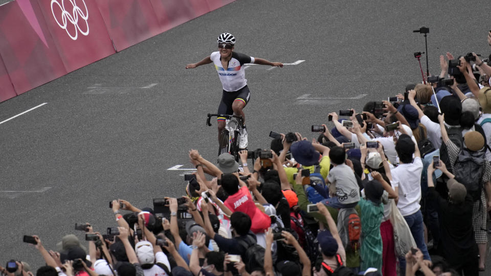 Richard Carapaz of Ecuador reacts after winning the men's cycling road race at the 2020 Summer Olympics, Saturday, July 24, 2021, in Oyama, Japan. (AP Photo/Christophe Ena)