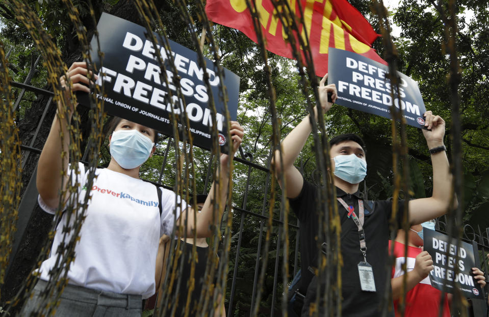 Supporters of the country's largest TV network ABS-CBN holds slogans during a rally outside the House of Representatives in Manila, Philippines, Thursday, July 9, 2020. ABS-CBN was shut down by the government's telecommunications regulator last May after its 25-year franchise expired. Congress has been hearing the network's request for a franchise renewal. The shutdown has been criticized as it cut off a major source of information on the COVID-19 pandemic in a Southeast Asian hot spot of the disease. (AP Photo/Aaron Favila)