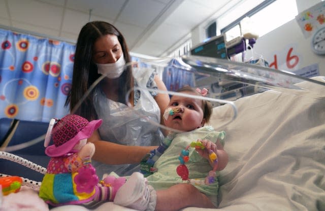 Leyla Bell, 10 months, with her mother Savana, a patient on Ward 23 at the Freeman Hospital in High Heaton, Newcastle Upon Tyne, who is in need of a heart donor